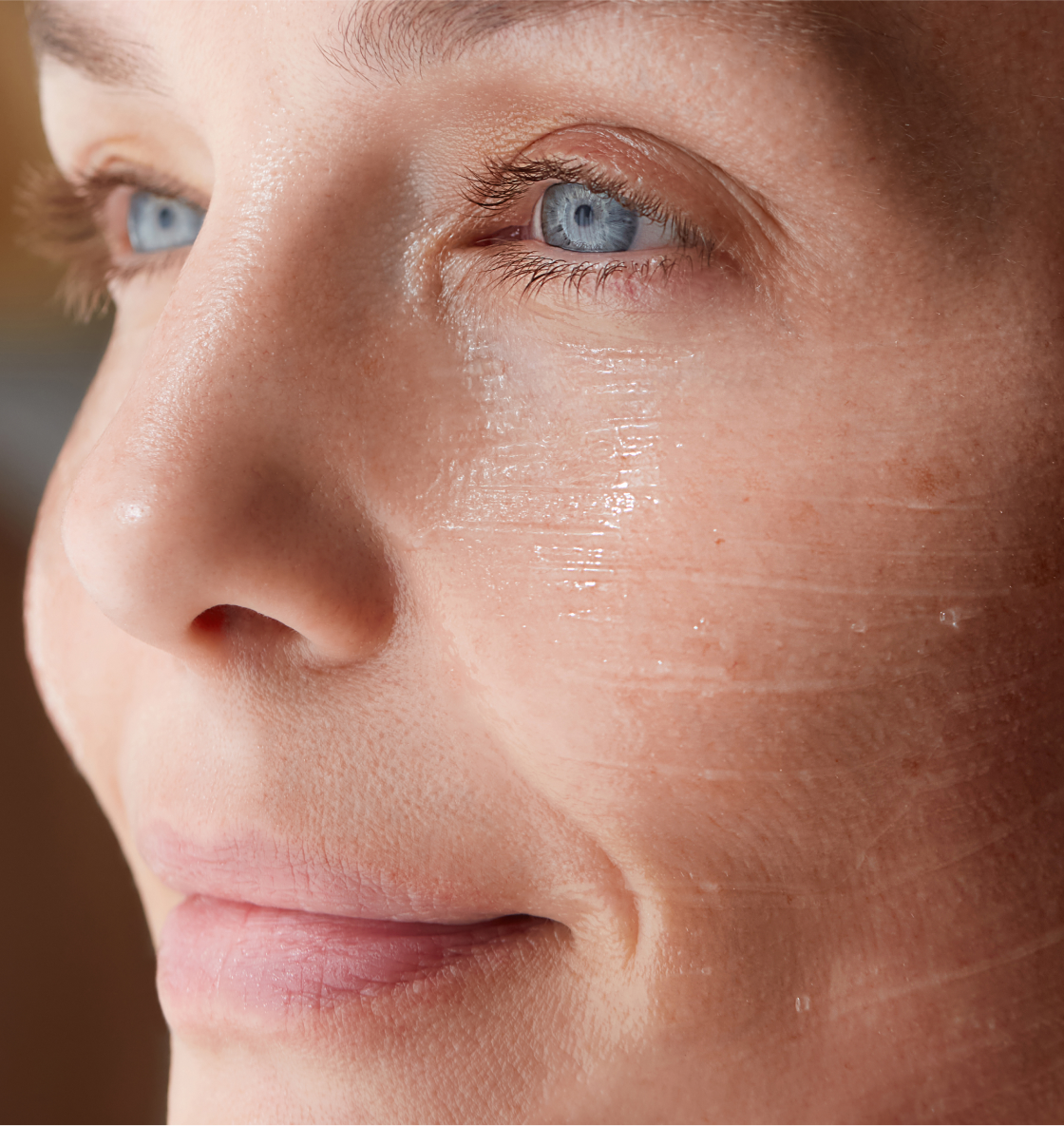 Woman holding a Hanacure brush near her face